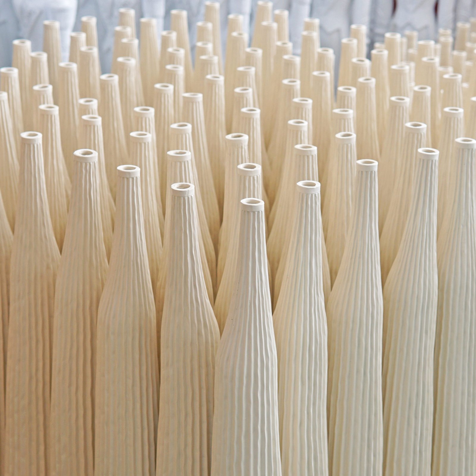 Elegant ribbed vases in production showcasing craftsmanship