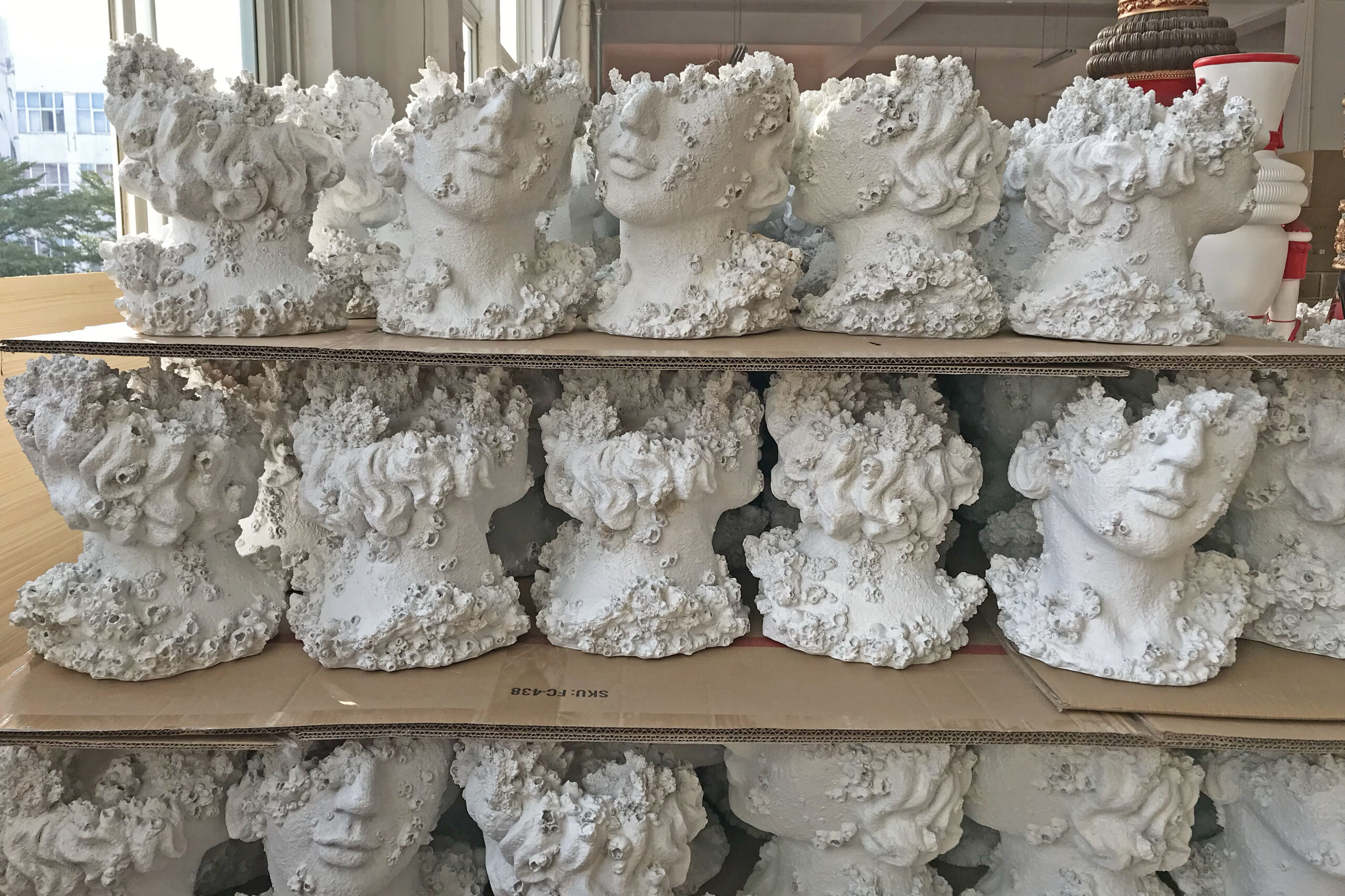 Finished polyresin statues stored in bulk lots before packing