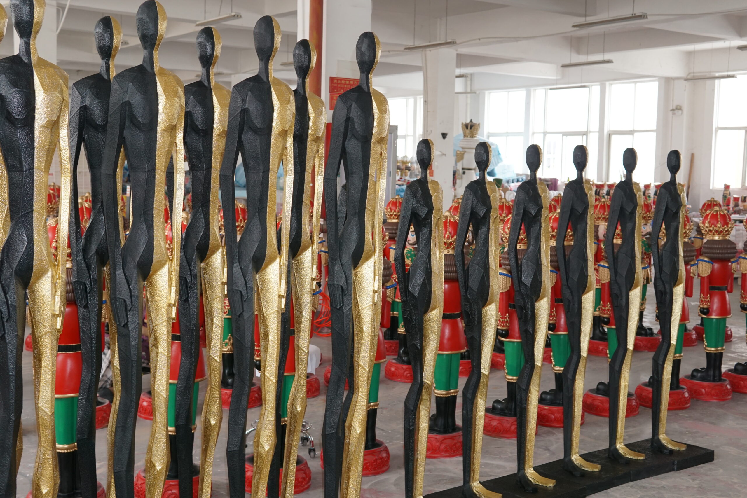 Uniform finish and alignment across a large batch of statues before carton packing